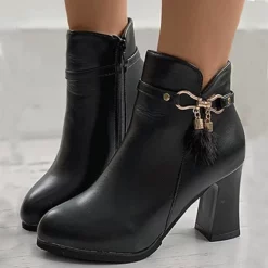 WMNS Tulip Opening Strap And Fuzzy Pompom Chunky High Heel Boots